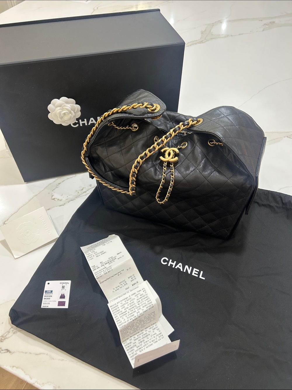CHANEL Black Quilted caviar Lambskin medium Chanel 25 Gold Chain